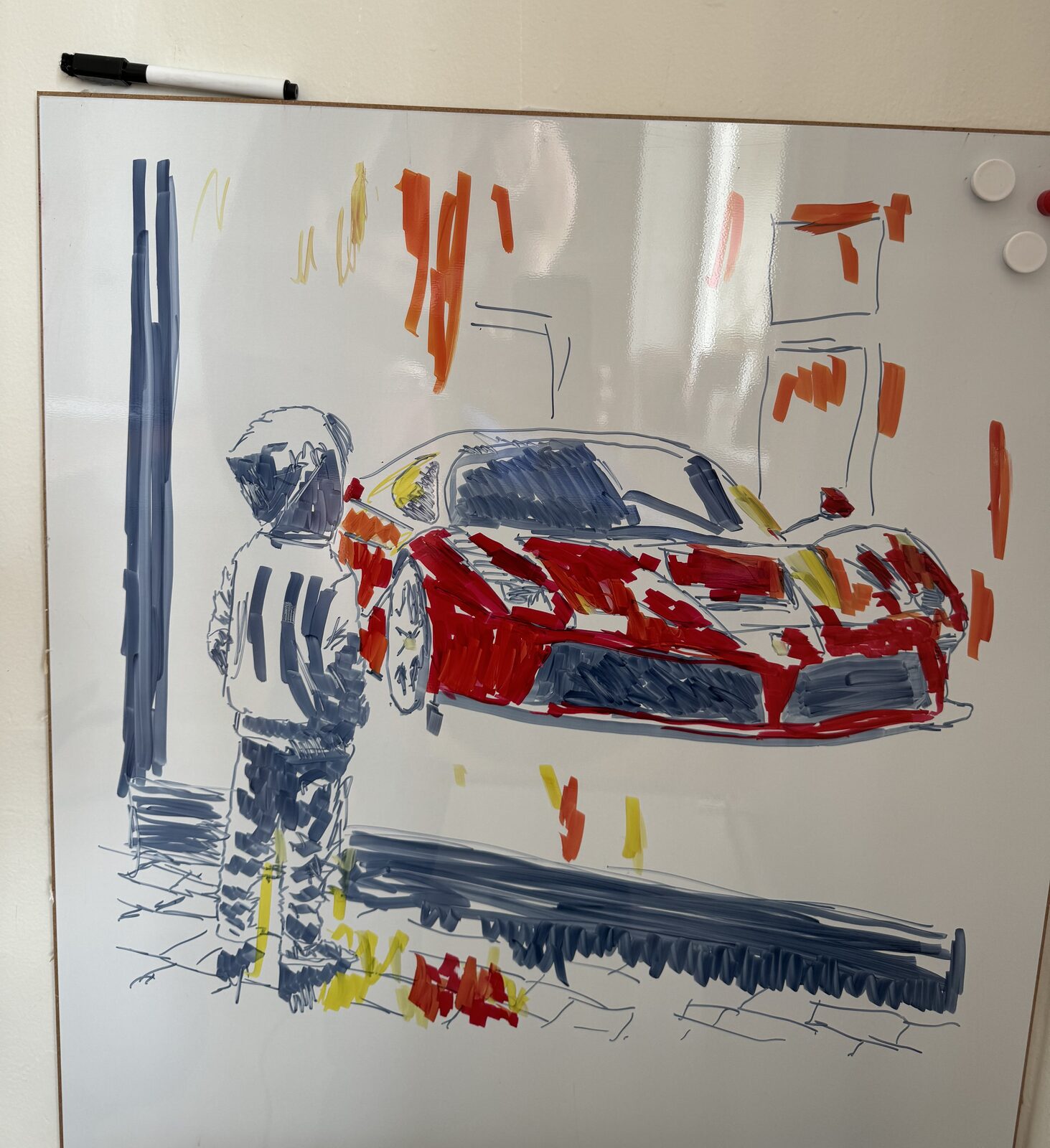 A race car and a young onlooker drawn on a whiteboard in marker pen in under two minutes