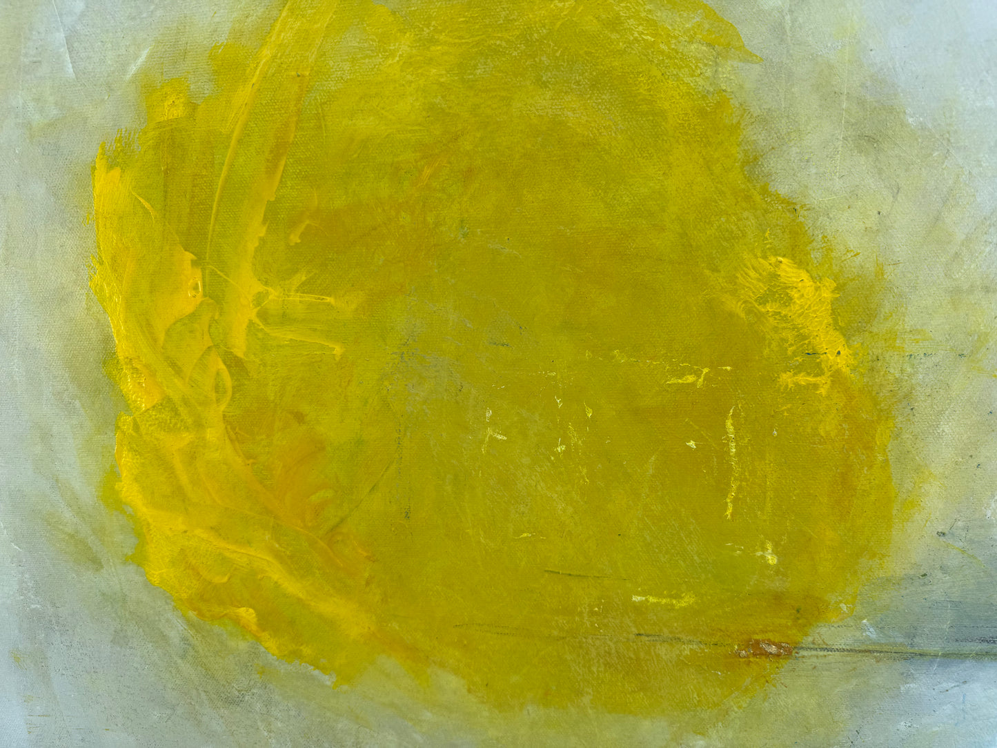 Yellow abstract painting on a textured gray background