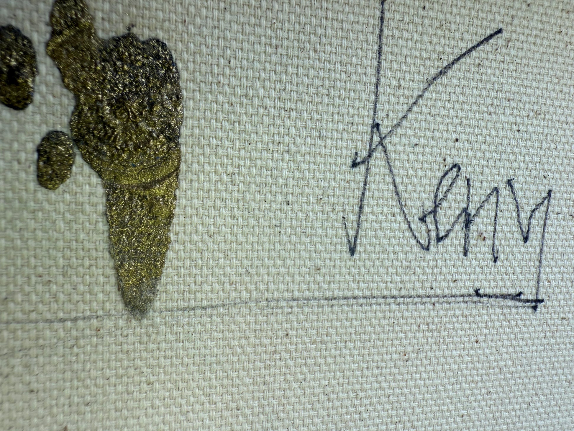 Signature on a textured fabric surface